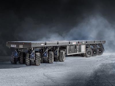 Cамоходные модульные транспортные средства с электронным управлением, предназначенные для внутризаводских перевозок грузов весом до 1000 тонн. Световое решение SPMT.