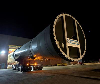 After a final inspection, the element with a diameter of 6.8 metres is moved out of the hall to the storage area by an SPMT self-propelled modular transporter.